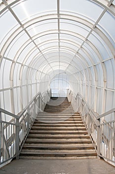 Staircase in glass corridor