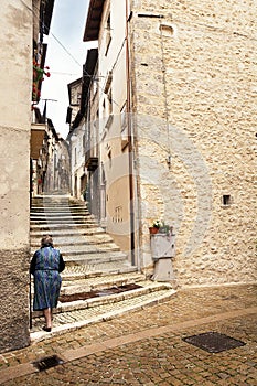 Staircase with a grandmother in the historic center of Scanno I