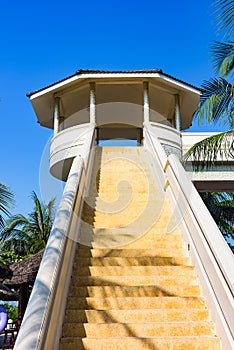 Staircase with a hotel veranda up