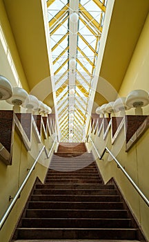 Staircase with lamps under glass ceiling