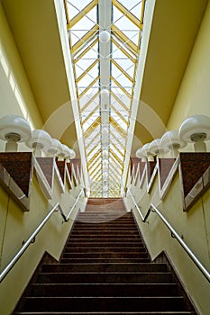 Staircase with lamps under glass ceiling