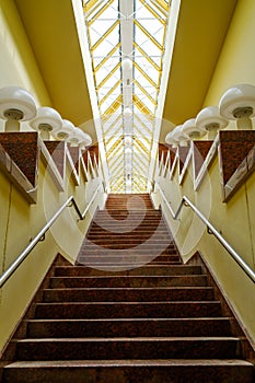 Staircase with lamps under glass ceiling