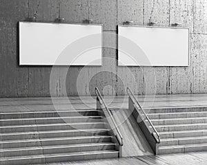 Staircase leading to two empty billboards on a granite wall. Interior.