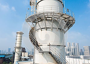 Staircase leading up the side of an industrial chimney in a thermal power plant