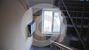 Staircase with letterboxets and window in apartment building