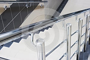 Staircase with metallic stair railing
