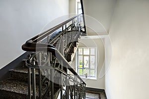 Staircase with old, decorative railing