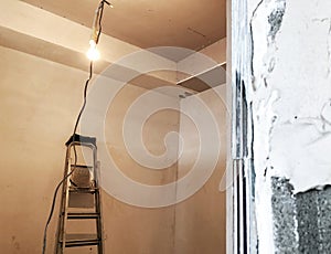 A staircase in the repair room. Material for repairs in an apartment is under construction remodeling rebuilding and renovation