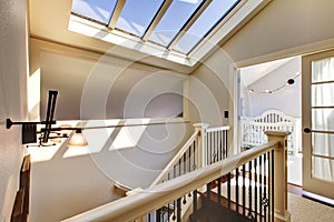 Staircase with skylight and baby room. photo