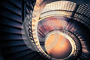 Staircase in spiral or swirl shape, fibonacci golden ratio composition, abstract or architecture concept, dark vintage mysterious