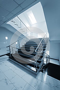 Staircase with a steel handrail