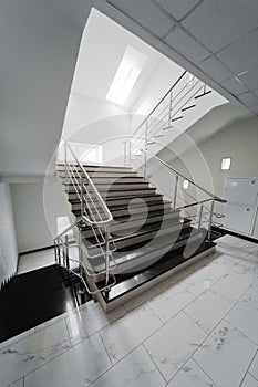Staircase with a steel handrail