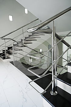 Staircase with a steel handrail