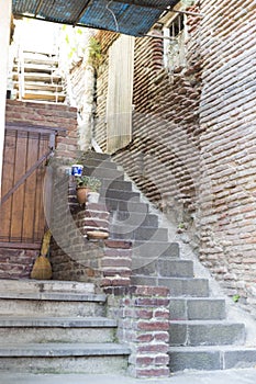 Staircase to the old building in the city of Tbilisi, Georgia. The architecture of the old city. Stone stairs.