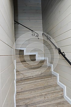 Staircase. White classic stairway. Wooden spiral staircase in the house.