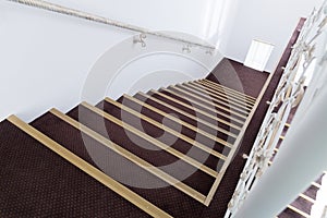 A staircase in the white passage