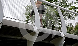 staircase and wide pedestrian bridge with perforated metal