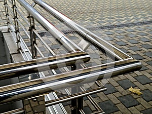 staircase and wide pedestrian bridge with perforated metal floor.