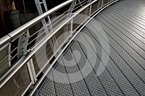 staircase and wide pedestrian bridge with perforated metal floor. galvanized