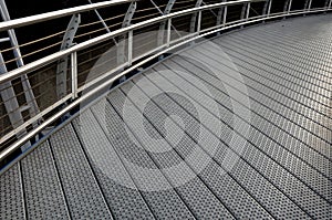 staircase and wide pedestrian bridge with perforated metal floor. galvanized