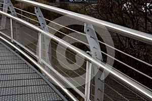 staircase and wide pedestrian bridge with perforated metal floor. galvanized