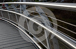 staircase and wide pedestrian bridge with perforated metal floor. galvanized