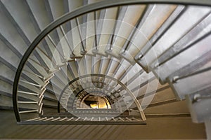 A staircase winding down a building