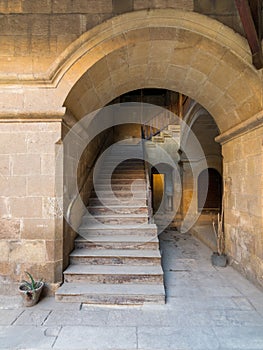 Staircase with wooden balustrade leading to an old abandoned historic building, Cairo, Egypt photo
