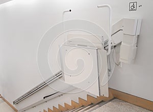 Stairlift on staircase for elderly people in a building