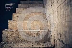 Stairs architecture unfinished at basement. Cement concrete staircase at house construction site