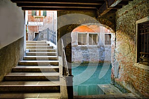 Stairs, archway and canal in Venice
