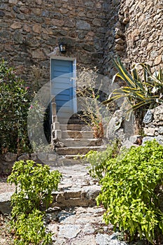 Stairs and blue entrance door Corsica