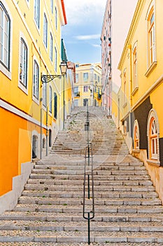 Stairs of the colorful street Travessa da Arrochela on a sunny day in summer. Travel concept. Lisbon, Portugal. Europe