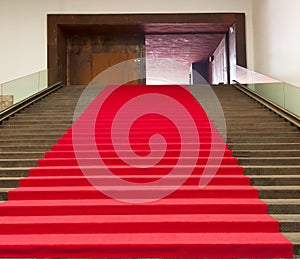 Stairs covered with red carpet