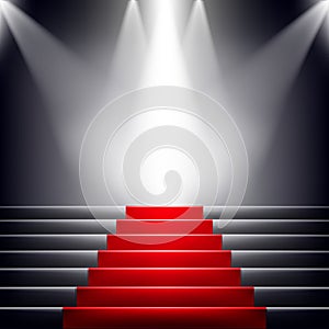 Stairs covered with red carpet.