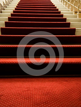 Stairs covered with red carpet
