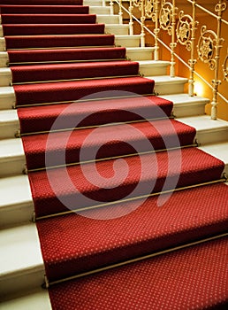 Stairs covered with red carpet