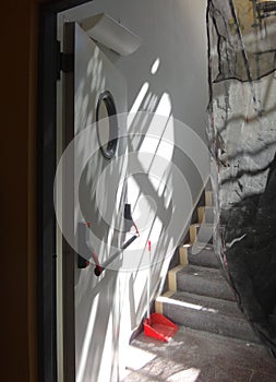 Stairs between floors with an open door during the renovation of the building