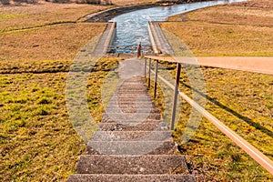 The stairs go down to the floodgates of dam