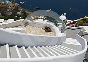 Stairs leading down to Aegan Sea. Oia, Santorini, Greece.