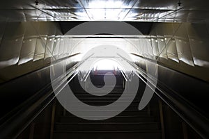 Stairs leading out of concrete pedestri subway.