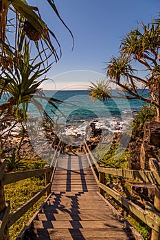 Stairs leading to beach at sunset in Queensland