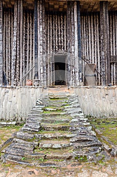 Stairs leading to entrance of wood and bamboo Achum at traditional Fon`s palace in Bafut, Cameroon, Africa photo