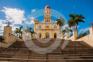 Stairs leading to the temple Basilica Virgen de la Caridad against the blue sky. Roman Catholic minor Catholic cathedral dedicated