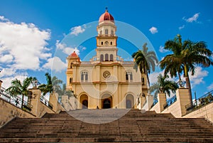 Stairs leading to the temple Basilica Virgen de la Caridad against the blue sky. Roman Catholic minor Catholic cathedral dedicated