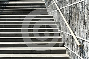 Stairs with metal handrailing outdoors on sunny day