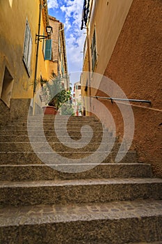 Stairs on a narrow street in the Old Town of Villefranche sur Mer, France