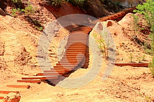 Stairs in ochre coloured landscape, Roussillon, France