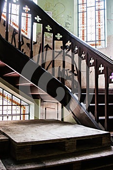 Stairs and stained windows of an abandoned Villa.