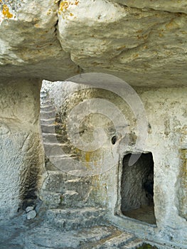 Stairs in stony cave house